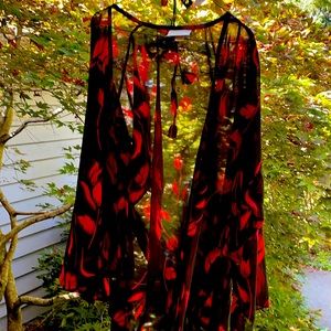 Lingerie outfit that is black with red tulips